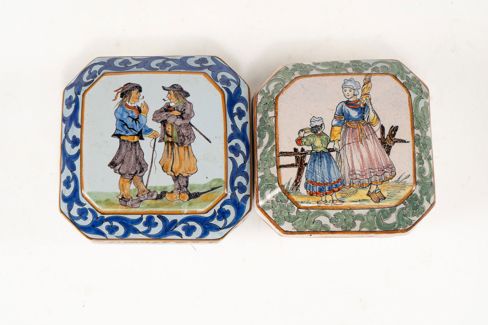 Pair of French Faience Quimper Boxes with Lid and Feet: Pair of French Faience Quimper Boxes with Lid and Feet. 1 Porquier Beau box - lid of box depicts two men with canes and pipes standing together. The box is decorated with blue leaf patterns and yellow