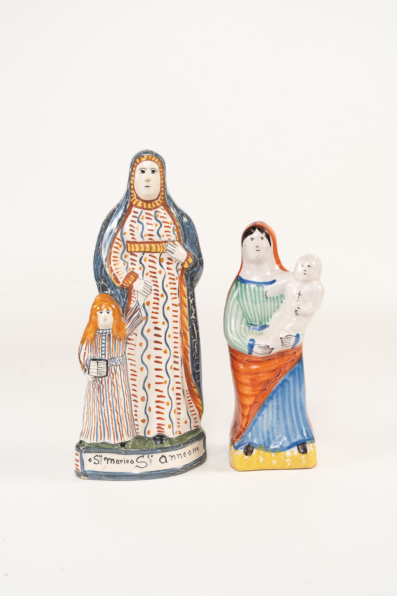 French Faience Virgin Mary and St. Anne Figures: French Faience Virgin Mary and St. Anne Figures. Virgin Mary figure is unmarked. St. Anne figure is signed Henriot Quimper France on back. Dimensions in order: H 9 x W 3.5 x D 3 inches, H 12 x W 5 x D