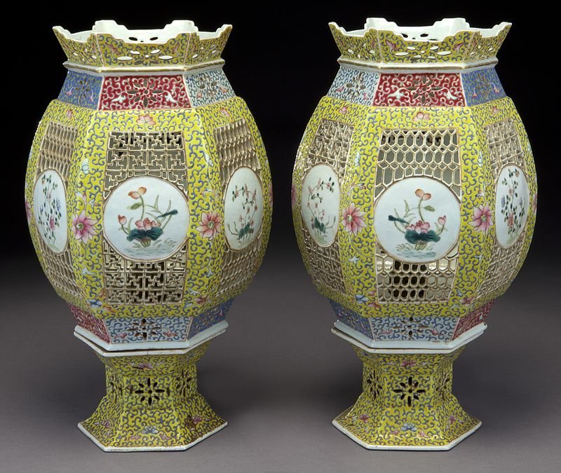 Pr. Chinese reticulated yellow porcelain lanterns,: Pr. Chinese reticulated yellow porcelain lanterns, depicting flowers. Old repairs to base of one lantern. Base: 3.75"H; Top: 11.85"H, Circa - Late 19th - Early 20th C.