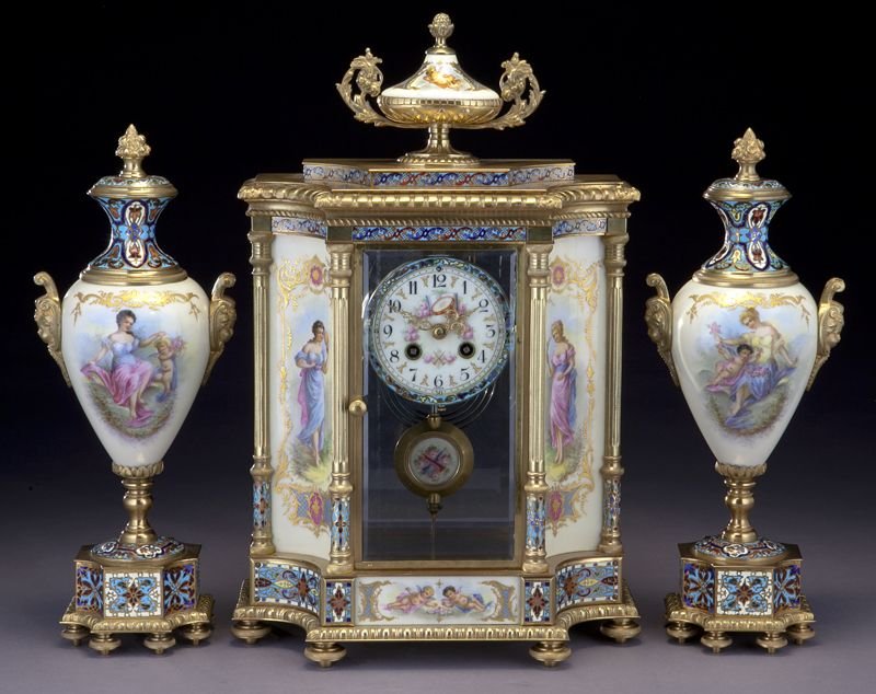 Sevres style 3pc. clock garniture set: Sevres style 3pc. clock garniture set the clock surmounted by a porcelain amphora-form finial and with chamleve cornice and trim, porcelain reserves to each side depicting beautiful maidens, the bevel