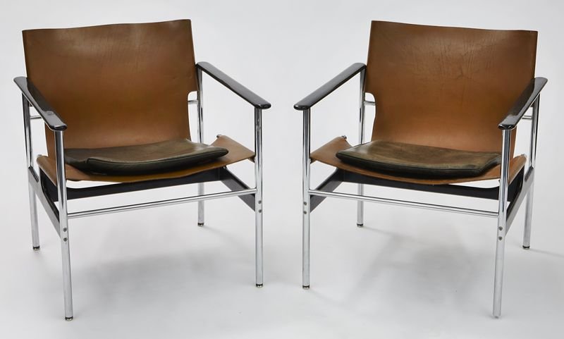 Pr. Charles Pollock for Knoll "657" leather sling: Pr. Charles Pollock for Knoll "657" leather sling chairs, with tan leather seats and detachable black padded leather cushions, black coated armrests and tubular chrome frame. With "Knoll International