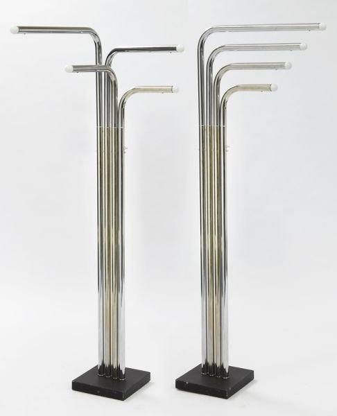 Pr. Sonneman for Reggiani chrome floor lamps: Pr. Sonneman for Reggiani chrome floor lamps with four articulating, adjustable arms each with a socket end designed by Robert Sonneman. 68''H x 24''W x 11.5''D, Circa - 1970.