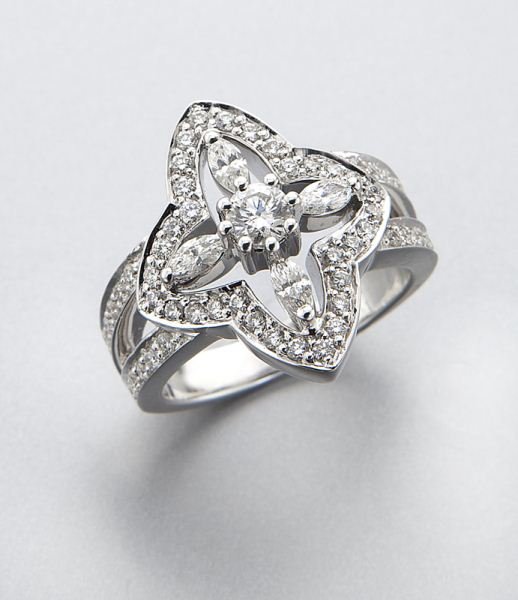 Kwiat 18K gold and diamond ring: Kwiat 18K gold and diamond ring mounted with 61 round brilliant and marquise cut diamonds, 1.00 cts. approximate total, G- H color, SI clarity, mounted in 18K white gold. Stamped, "18K Kwiat 48816." 1