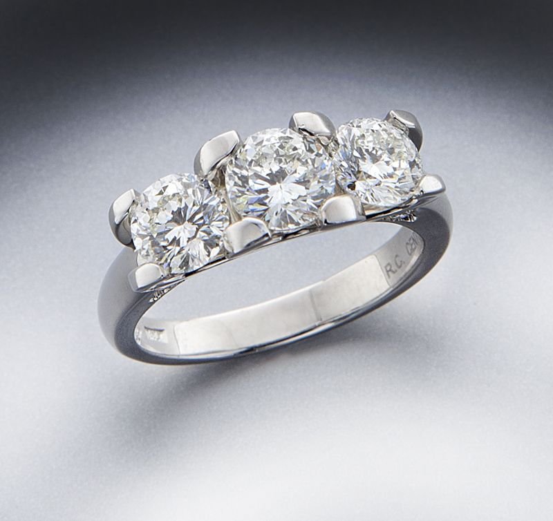 Roberto Coin platinum and diamond ring: Roberto Coin platinum and diamond ring featuring a central "Cento" cut diamond, .75 cts. approximate, flanked by a pair of "Cento" cut diamonds, 1.20 cts. approximate total, H color, VS1 clarity, with