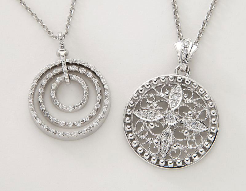 (2) Roberto Coin 18K gold and diamond necklaces,: (2) Roberto Coin 18K gold and diamond necklaces, (1) mounted with 61 round brilliant cut diamonds in a triple circle design on an 18K white gold chain. Stamped, "Roberto Coin 18K 750 Italy." Chain: 18
