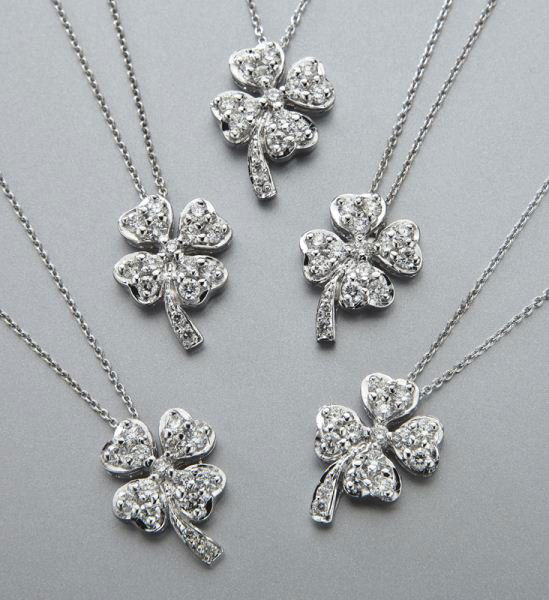 (5) Roberto Coin 18K gold and diamond necklaces: (5) Roberto Coin 18K gold and diamond necklaces in the lucky clover design, each mounted with round brilliant cut diamonds, .12 cts. approximate total each, G-H color SI clarity, mounted in 18K white