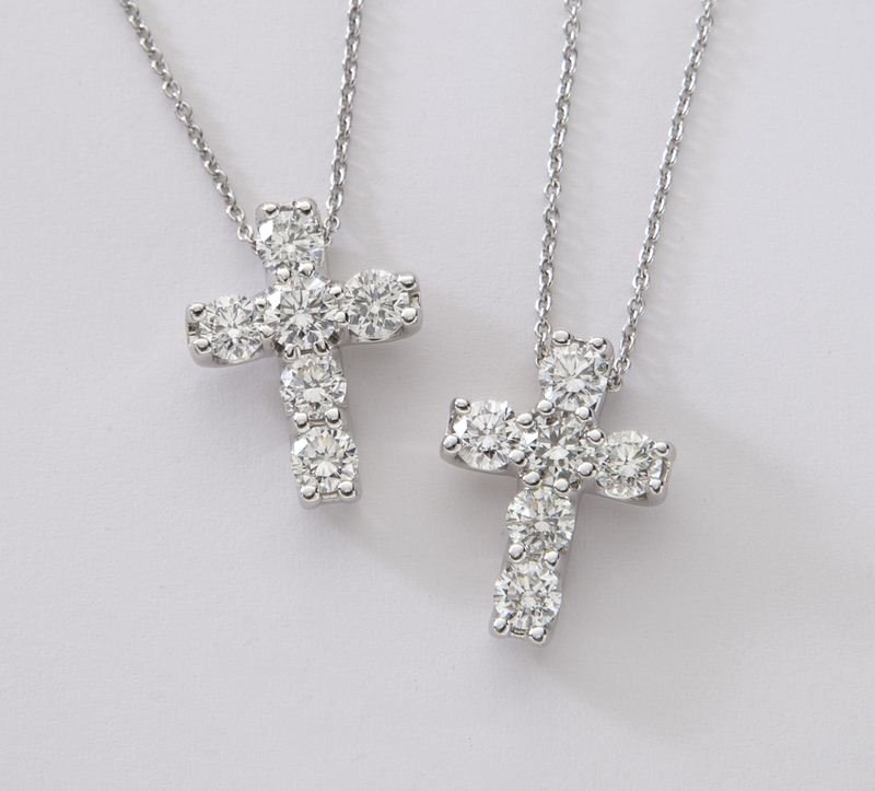 (2) Roberto Coin 18K and diamond cross necklaces,: (2) Roberto Coin 18K and diamond cross necklaces, each having six round brilliant cut diamonds, 1.20 cts. approximate total each, G-H color, VS2-SI1 clarity, mounted in 18K white gold and on an 18K wh