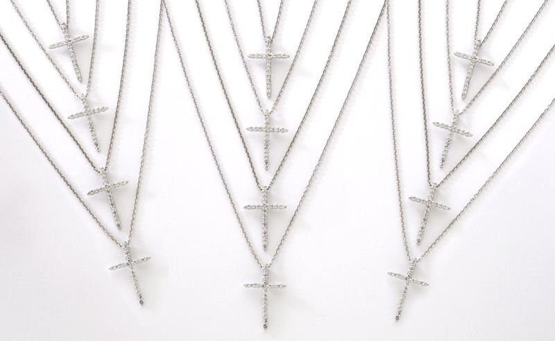 (12) Roberto Coin 18K and diamond cross necklaces,: (12) Roberto Coin 18K and diamond cross necklaces, each mounted with 22 round brilliant cut diamonds, .18 cts, approximate total each, G-H color, VS2-SI1 clarity, mounted in 18K white gold and on an 1