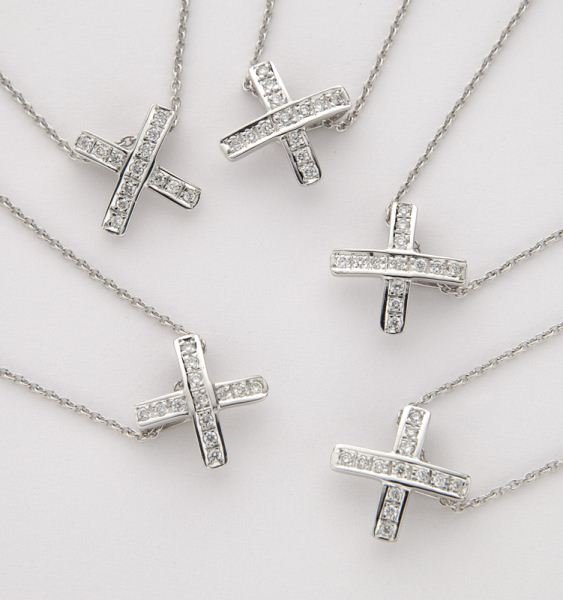 (5) Roberto Coin 18K and diamond "X" necklaces,: (5) Roberto Coin 18K and diamond "X" necklaces, each having 13 round brilliant cut diamonds, .13 cts. approximate total each, G- H color, VS2-SI1 clarity, mounted in 18K white gold and on an 18K white