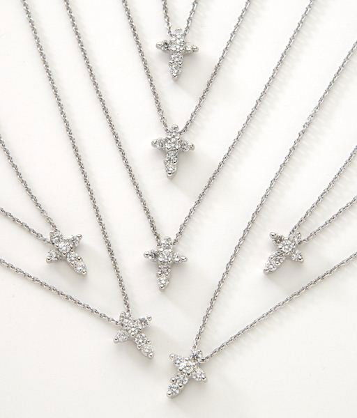(7) Roberto Coin 18K and diamond cross necklaces,: (7) Roberto Coin 18K and diamond cross necklaces, each mounted with six round brilliant cut diamonds, .11 cts. each approximate total, G-H color, VS2-SI1 clarity, mounted in 18K white gold and on an 1