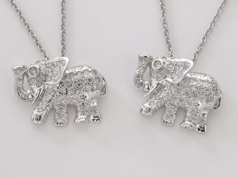 (2) Roberto Coin 18K gold and diamond elephant: (2) Roberto Coin 18K gold and diamond elephant pendants, each featuring 41 round brilliant cut diamonds, .40 cts. approximate total, in 18K white gold. Stamped, "18K Italy 750" and bears Roberto Coin