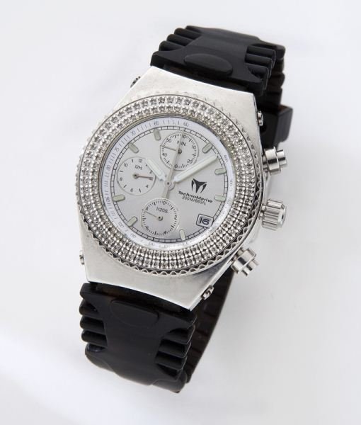 Women's TechnoMarine TechnoDiamond chronograph: Women's TechnoMarine TechnoDiamond chronograph watch with a diamond set bezel, a stainless dial and case, and a black rubber band. Circa - Late 20th C.