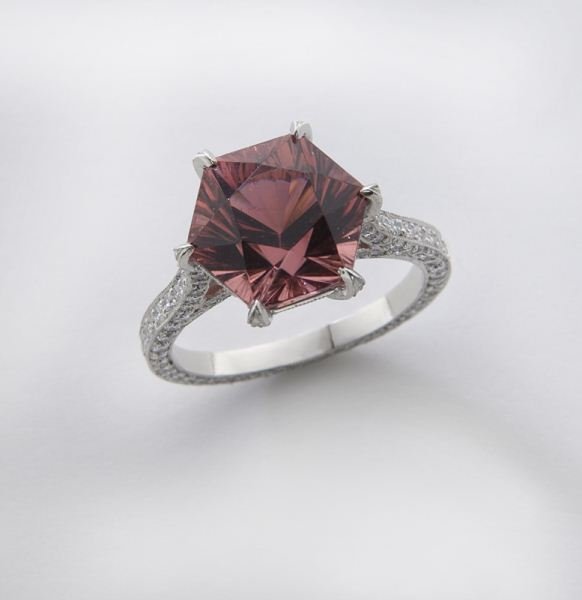 Platinum, diamond and tourmaline ring: Platinum, diamond and tourmaline ring featuring a central mixed cut hexagonal shaped tourmaline, 6.17 cts. approximate, mounted with 304 round brilliant cut diamonds in platinum. Stamped, "NM Plat." 6