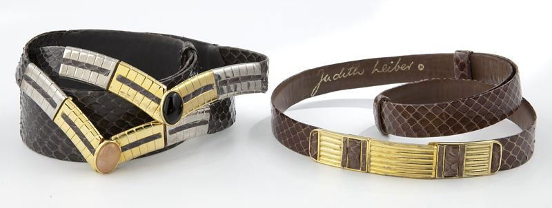 (2) Judith Leiber snakeskin belts: (2) Judith Leiber snakeskin belts comprising (1) black snakeskin belt with gold and silver tone buckle, 31''L; and (1) brown snakeskin belt with gold tone buckle, 30''L. Circa - Late 20th C.