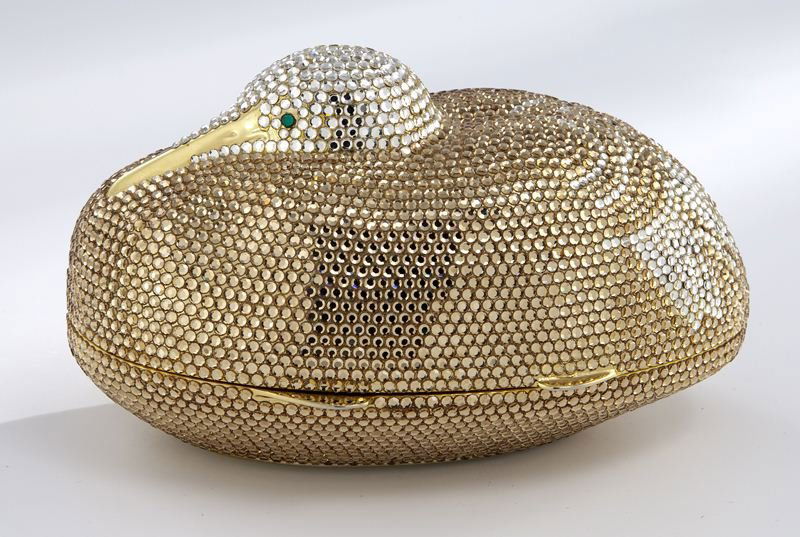 Judith Leiber crystal "Dove" minaudiere,: Judith Leiber crystal "Dove" minaudiere, the figural evening bag decorated with gold and white Austrian crystals hinging open at the center, the interior of gold tone leather. 3.25''H x 5.5''L x 3''W,