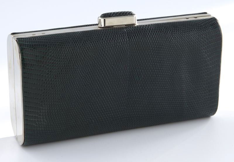 Judith Leiber forest green snake skin box clutch: Judith Leiber forest green snake skin box clutch with silver tone frame, the clasp covered by snake skin, silver leather interior, linked chain shoulder strap, and original mirror included. 4.25"H x 7