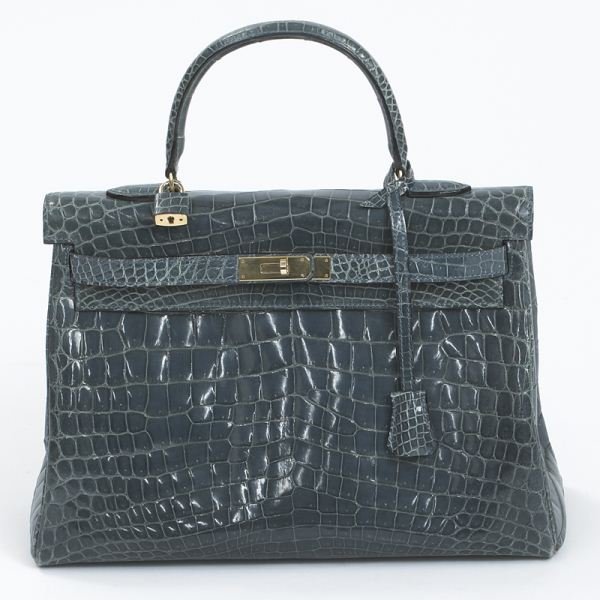 Laurent Effel Kelly-style blue crocodile bag: Laurent Effel Kelly-style blue crocodile bag with gold tone hardware, one slip and two zipper pockets to the leather interior, stamped "Laurent Effel, St. Barth's." 10"H x 13.5"W, Circa - 20th C.