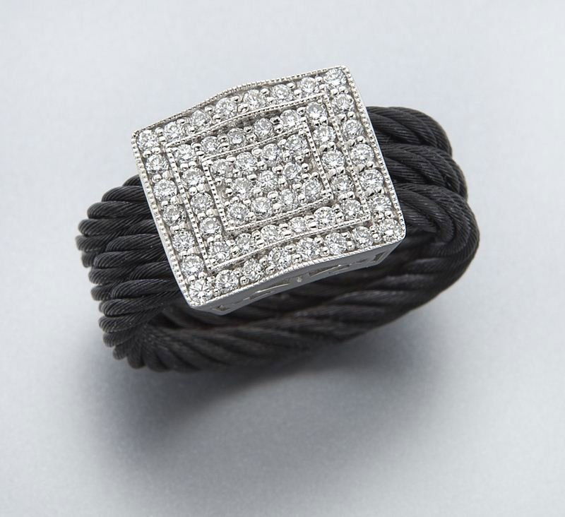 Charriol 18K gold and diamond ring: Charriol 18K gold and diamond ring from the Celtic Noir collection, mounted with 57 round brilliant cut diamonds, .85 cts. approximate total, mounted in 18K white gold, on a black cable band. Stamped,