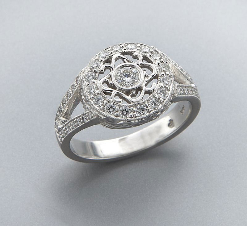 Penny Preville 18K gold and diamond ring: Penny Preville 18K gold and diamond ring mounted with 44 round brilliant cut diamonds, set in 18K white gold. Stamped, "18K PP." 5.0 grams. Provenance: The estate of a gentleman, Dallas, Texas. Size 6