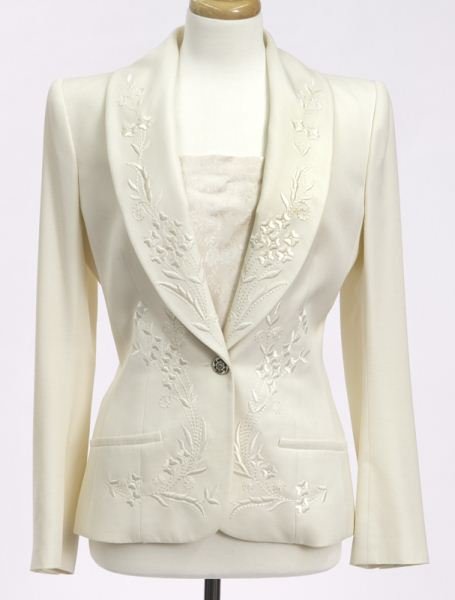 Galliano size 40 cream embroidered silk jacket: Galliano size 40 cream embroidered silk jacket together with a silk camisole, the jacket measuring 24.5'' long, the sleeves 25'' long each. Circa - 2000.