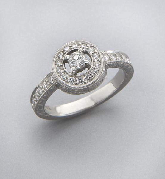Penny Preville 18K gold and diamond ring: Penny Preville 18K gold and diamond ring with 27 round brilliant cut diamonds in a circular design. Stamped, "18K PP." 5.5 grams. Provenance: The estate of a gentleman, Dallas, Texas. Size 6.25, Circa