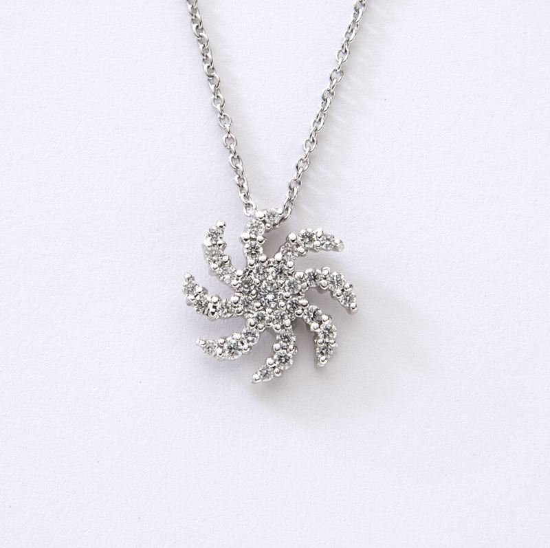 Roberto Coin 18K and diamond "Sunburst" necklace: Roberto Coin 18K and diamond "Sunburst" necklace mounted with 33 round brilliant cut diamonds, in 18K white gold, also mounted with Roberto Coin's signature hidden ruby. Stamped, "18K Italy 750" and b