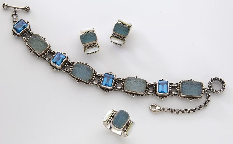 3 Pcs. Stephen Dweck sterling silver jewelry: 3 Pcs. Stephen Dweck sterling silver jewelry comprising: (1) bracelet with blue topaz, 7.5''L; (1) pair of earrings with mother-of-pearl, .75''L; and (1) ring with jade and mother-of-pearl, size 5.75.