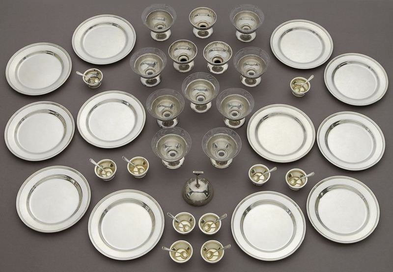 45 Pcs. American sterling silver items: 45 Pcs. American sterling silver items comprising (12) Gustav F. Kolb bread plates; (10) Gorham salt cellars and salt spoons; (12) Alvin sorbets, 9 having etched glass bowl liners; (1) Towle bell. Cir