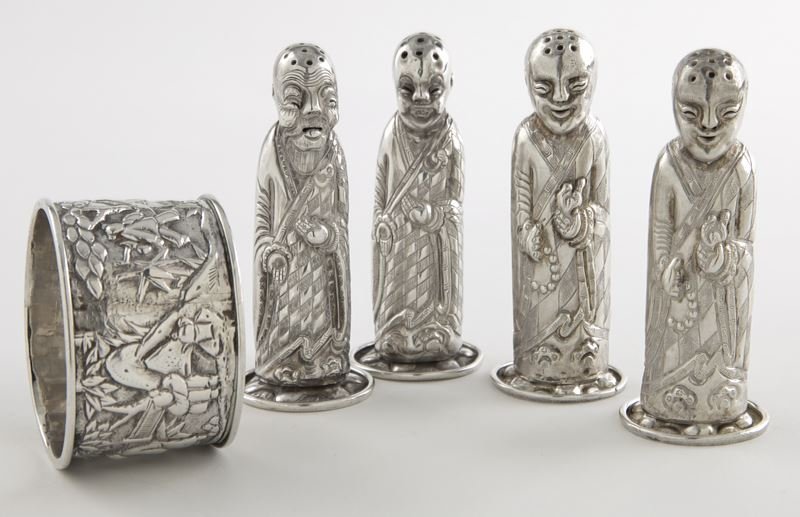 5 Pcs. Chinese Export silver: 5 Pcs. Chinese Export silver including (2) pairs of figural shakers, each with a pierced bald head, and (1) napkin ring with pastoral scene chased to the body, central cartouche monogrammed. The napki