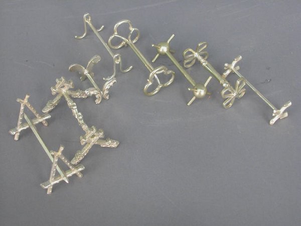 8 pcs. Asst. silver plate knife rests.