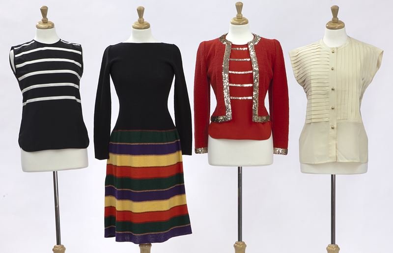 5 pcs. Adolfo couture inclu.:: 5 pcs. Adolfo couture inclu.: (2) silk blouses; (1) 2 pc. sweater set with blouse; (1) sweater dress measuring 41" L x 15.5" W at the bust x 14" W at the waist, flat. Tags marked for Adolfo. Circa - 1