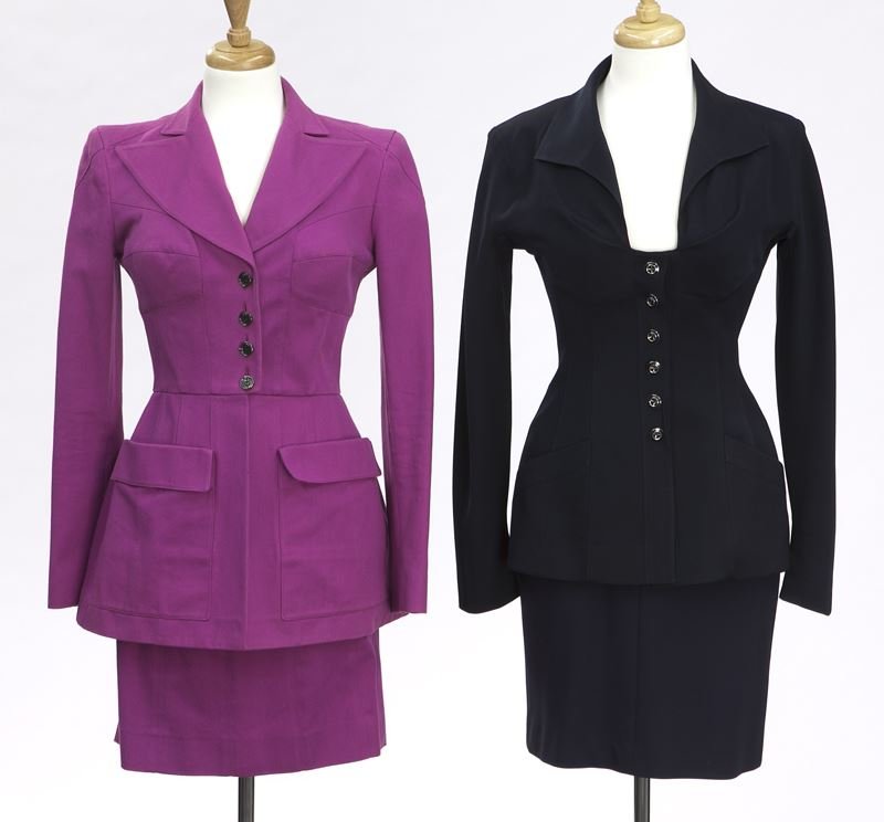 (2) Lagerfeld skirt suits: (2) Lagerfeld skirt suits including (1) in navy, size 36 and (1) in magenta, size 38, together with (1) Karl Lagerfeld silk scarf new in packaging. Circa - 1990's.