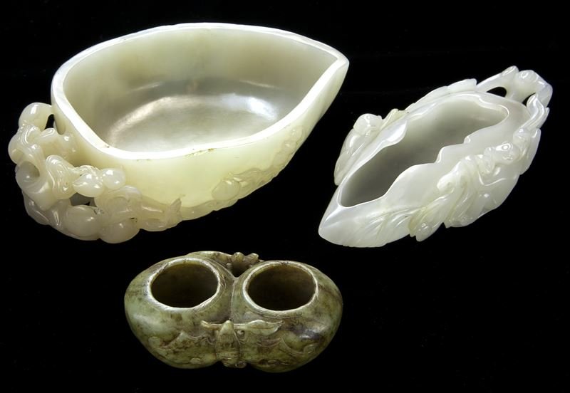 (3) Chinese carved jade scholar's cups.: (3) Chinese carved jade scholar's cups. (1) of peach form with its handle shaped as a chilong climbing atop, the stone of light greyish white matrix with few icy inclusions, having old collector's box