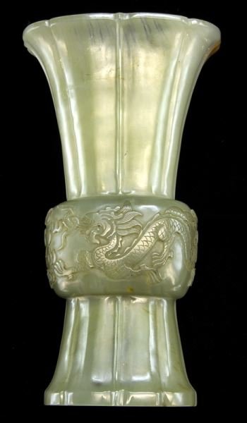 Chinese carved jade archaistic style gu form vase,: Chinese carved jade archaistic style gu form vase, the trumpet-form top and flare base, both with lobbed wall, are connected through an enlarged tubular center section adorned with archaistic dragon m