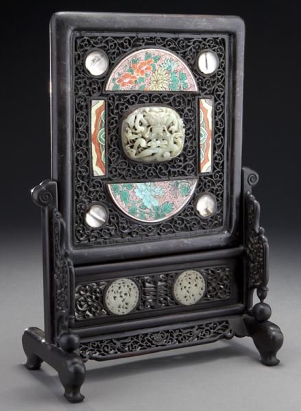Chinese Ming carved jade plaque on table screen.: Chinese Ming carved jade plaque on table screen. The central Ming carved jade plaque, 2.75"H x 3.75"W depicting a dragon is surrounded by porcelain plaques depicting flowers, set in a carved wood tabl