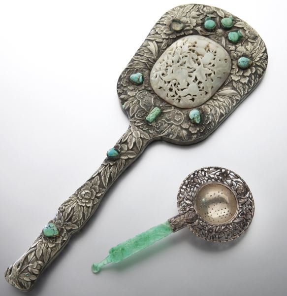 2 Pcs. Chinese Qing silver and jade/jadeite.: 2 Pcs. Chinese Qing silver and jade/jadeite. (1) large handheld mirror decorated with peony motif, embellished turquoise cabochons and a reticulated celadon jade plaque depicting a floral vine, 15"L x