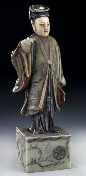 Chinese Qing carved soapstone figure: Chinese Qing carved soapstone figure depicting a male dignity, carved in three sections, using different tone of stone to achieve the best effect, further adorned with incised details and color pigmen