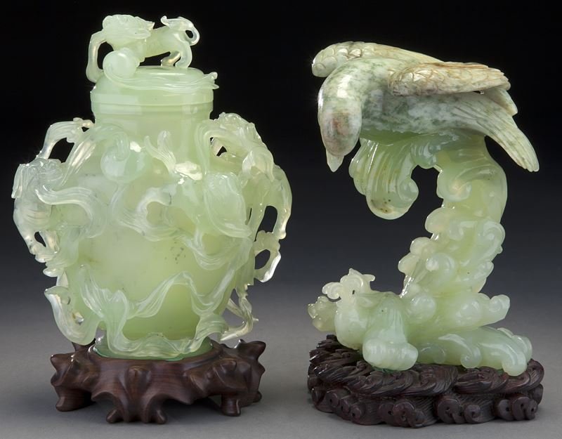 (2) Chinese serpentine carvings.: (2) Chinese serpentine carvings. (1) lidded vase decorated with lions and ribboned balls on the exterior in high relief and deep undercut, 7"H x 6"W; (1) eagle descending on wavy water to prey on a le
