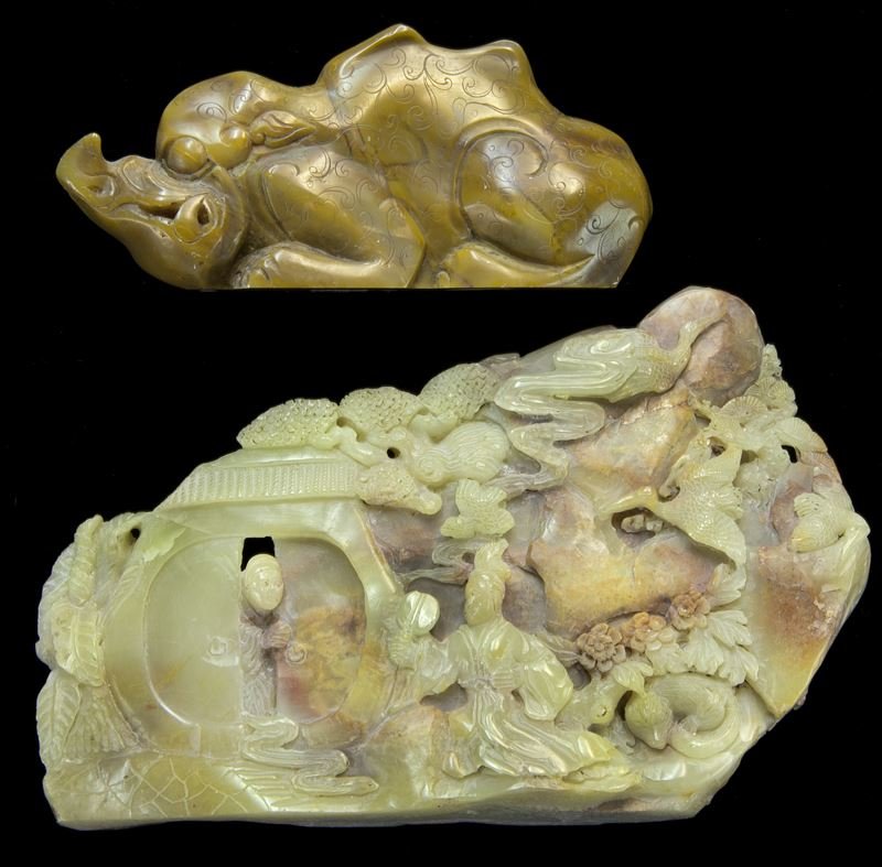 (2) Chinese soapstone carvings.: (2) Chinese soapstone carvings. (1) large boulder shanzhi depicting daily life in a mountainous village, the stone matrix of light beige tone with icy patches and streaks of "chicken blood" red inclus