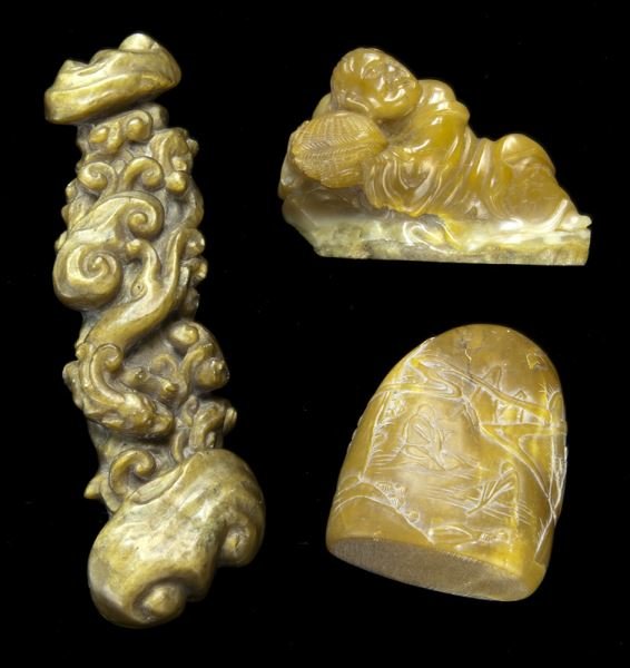 (3) Chinese carved stone scholar's items.: (3) Chinese carved stone scholar's items. (1) agate or tiger's eye stone ruyi scepter well carved in high relief with a chilong amidst wavy motif, 5.5"L x 1.5"W; (1) soapstone carving of a reclining i