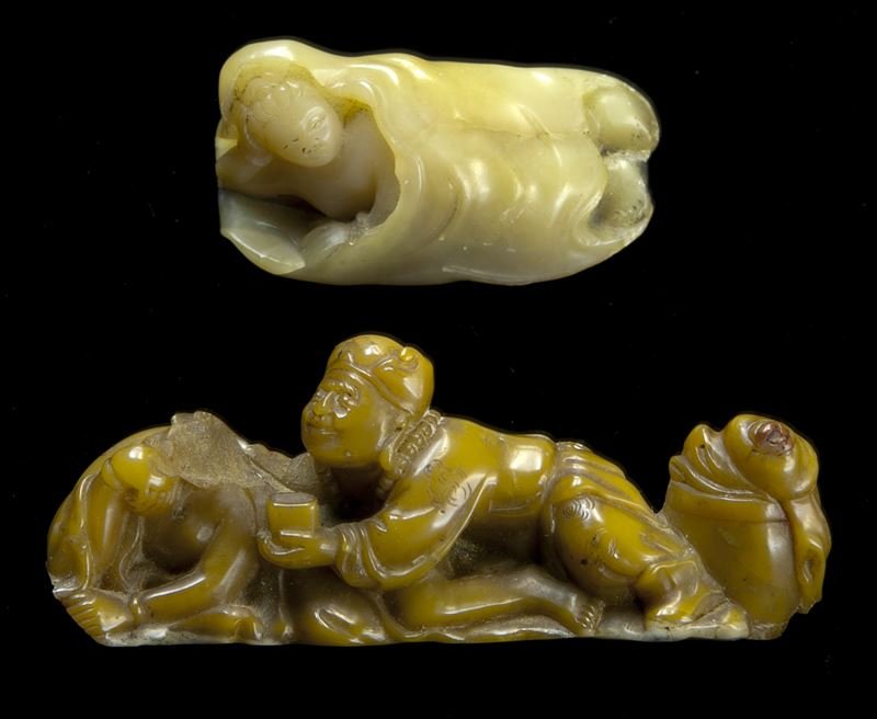 (2) Chinese late Qing - early Republic soapstone: (2) Chinese late Qing - early Republic soapstone erotic carvings. (1) depicting a youthful woman beneath a blanket; (1) depicting an erotic couple. Largest: 0.75"H x 2.25"W, Circa - 20th C.