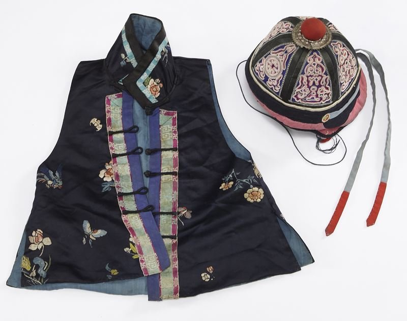 2 Pcs. Chinese Qing embroidered clothing.: 2 Pcs. Chinese Qing embroidered clothing. (1) linen child's vest; (1) cap in Manchu style. Provenance: The child cap from the Ex-Collection of a prominent Northern California collector. Vest: 17.5"H x