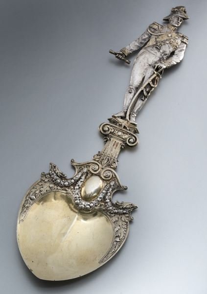 Hanau silver spoon depicting Duke of Wellington: Hanau silver spoon depicting Duke of Wellington finely cast depicting the hero of Waterloo atop his column, the shaped bowl in silver gilt. 4.67 ozt. 10.5" L, Circa - 1900.
