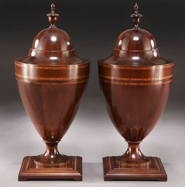 Pr. inlaid mahogany urn shaped knife urns with: Pr. inlaid mahogany urn shaped knife urns with fitted interiors and standing on square inlaid molded bases. 27" H x 11" Dia., Circa - Late 20th C.