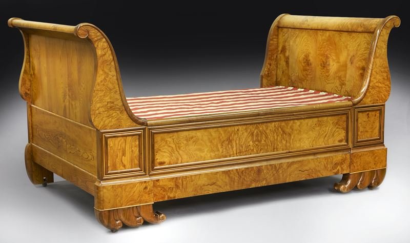 Austrian Biedermeier day bed: Austrian Biedermeier day bed in figured birch with scrolled ends on waveform front feet. 43.25" H x 84" W x 47" D, Circa - 1830.