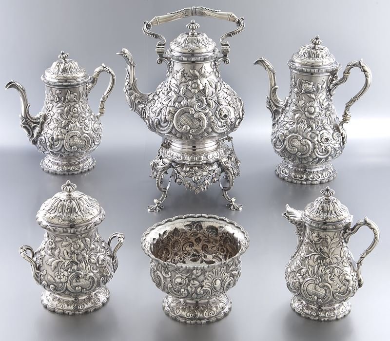 Rare Grosjean & Woodward for Tiffany sterling tea: Rare Grosjean & Woodward for Tiffany sterling tea and coffee service including a teapot, coffee pot, kettle on a stand, sugar bowl, cream jug and waste bowl all chased in an elaborate floral repousse 