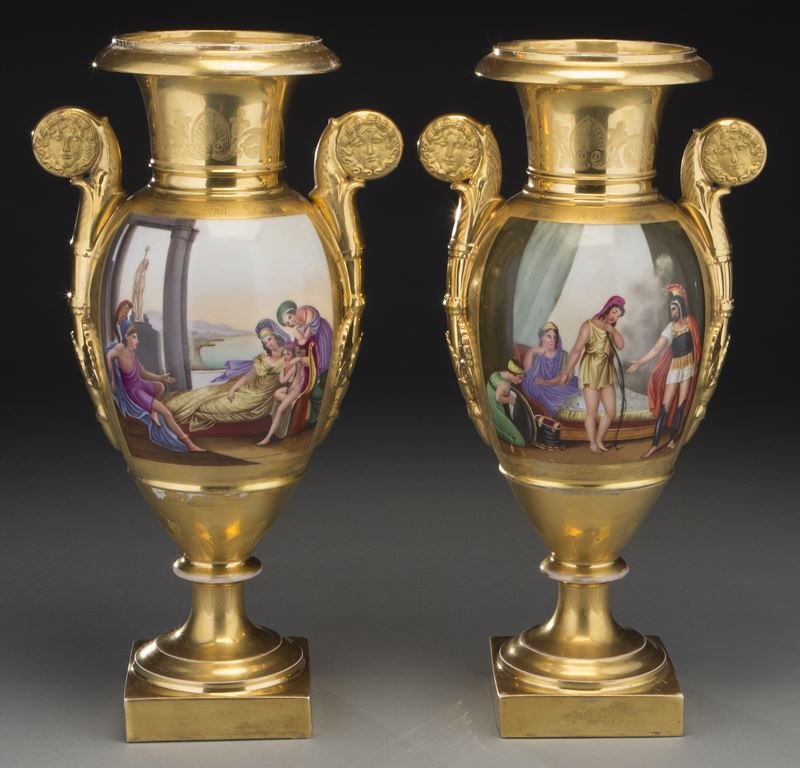 Pr. Old Paris porcelain urns of baluster form: Pr. Old Paris porcelain urns of baluster form with scrolled handles, each urn decorated with hand painted panels depicting romantic scenes, the reverse with gilt on gilt Empire motif, each raised on a