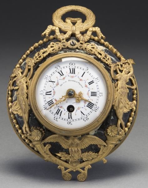 French gilt bronze and marble petite wall clock: French gilt bronze and marble petite wall clock the enameled dial surrounded by classical maidens, cornucopia and an eagle holding arrows in it's talons, the dial marked, "Black, Starr & Frost" and de
