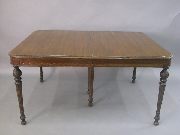 American walnut dining table set on: American walnut dining table set on turned, tapered, and fluted legs, expands for 2 additional leaves,10.5"ea. w/out leaves-2'7"H x 5'W x 3'10"D, Circa - 1920's.
