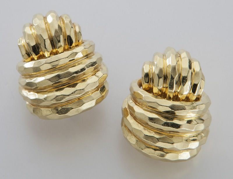 Henry Dunay 18K yellow gold earrings: Henry Dunay 18K yellow gold earrings having a hammered surface with a clip backs. Stamped, "Dunay 18K " 26.9 grams. Provenance: From the estate of the late Mrs. I. C. Deal, Dallas, TX. 1" L, Circa - 2